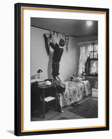 Freshman Mary Lloyd-Rees Hanging Both Harvard and Yale Banners in Her Room-Lisa Larsen-Framed Photographic Print
