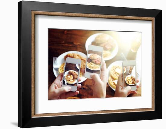 Friends Using Smartphones to Take Photos of Food with Instagram Style Filter-evren_photos-Framed Photographic Print