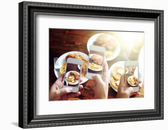 Friends Using Smartphones to Take Photos of Food with Instagram Style Filter-evren_photos-Framed Photographic Print