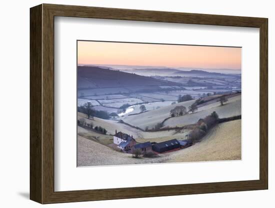 Frost coated countryside and farm buildings at sunrise, Exe Valley, Devon, England. Winter (March) -Adam Burton-Framed Photographic Print