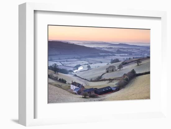 Frost coated countryside and farm buildings at sunrise, Exe Valley, Devon, England. Winter (March) -Adam Burton-Framed Photographic Print
