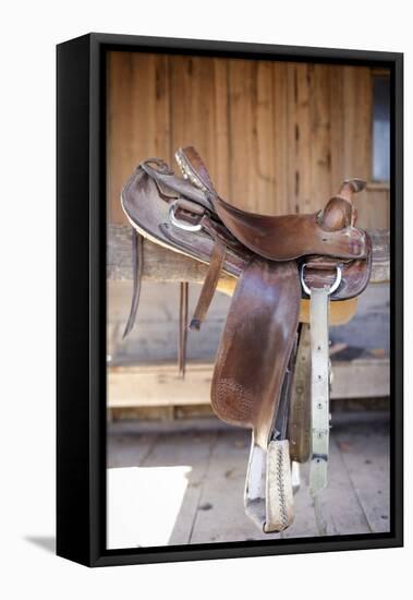 Full view of a Saddle resting on the railing, Tucson, Arizona, USA.-Julien McRoberts-Framed Premier Image Canvas