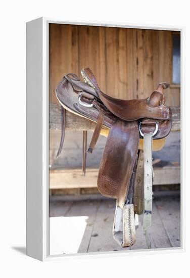 Full view of a Saddle resting on the railing, Tucson, Arizona, USA.-Julien McRoberts-Framed Premier Image Canvas