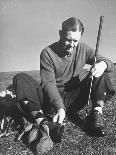Golfer Byron Nelson Cleaning the Cleats on His Shoes-Gabriel Benzur-Mounted Premium Photographic Print