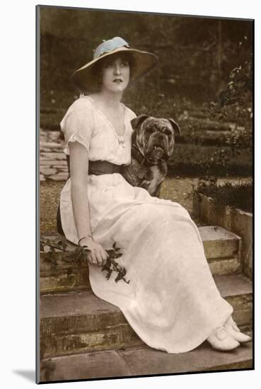 Gabrielle Ray, English Actress, with a Dog in a Garden-null-Mounted Photographic Print