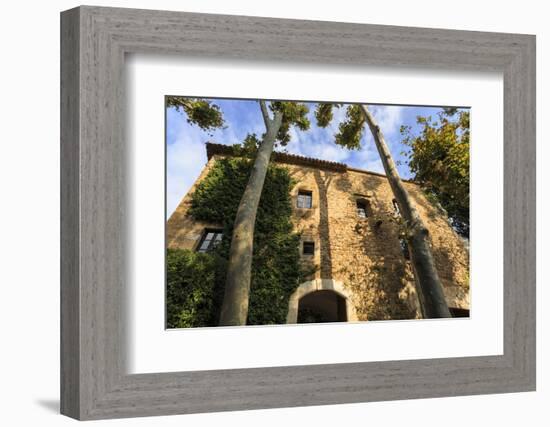 Gala Dali Castle Museum facade amidst tall trees, medieval home of Salvador Dali, Pubol, Baix Empor-Eleanor Scriven-Framed Photographic Print