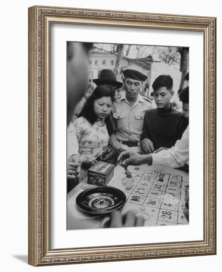 Game of Roulette at Fair in Central Highlands Celebrating New Year's Holiday-John Dominis-Framed Photographic Print