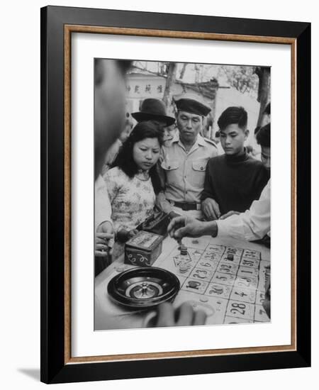 Game of Roulette at Fair in Central Highlands Celebrating New Year's Holiday-John Dominis-Framed Photographic Print