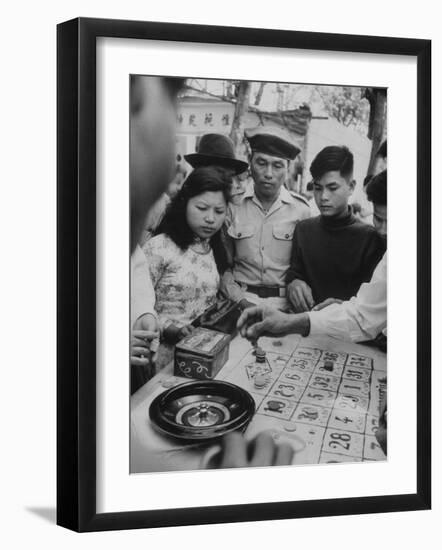 Game of Roulette at Fair in Central Highlands Celebrating New Year's Holiday-John Dominis-Framed Photographic Print