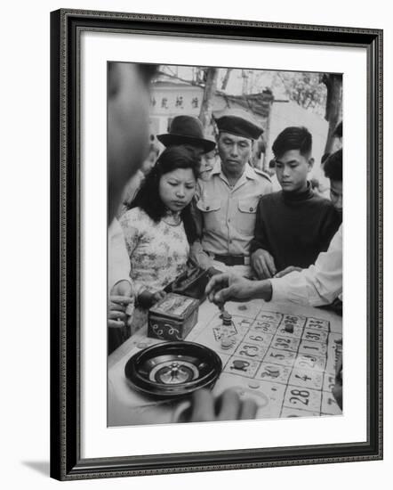 Game of Roulette at Fair in Central Highlands Celebrating New Year's Holiday-John Dominis-Framed Photographic Print