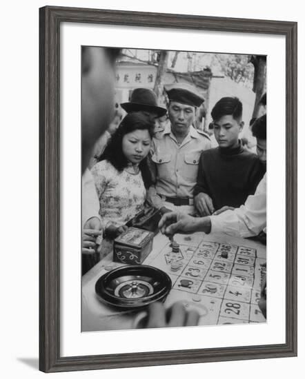 Game of Roulette at Fair in Central Highlands Celebrating New Year's Holiday-John Dominis-Framed Photographic Print