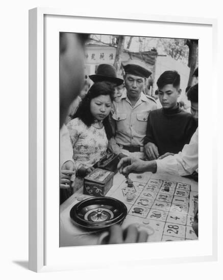 Game of Roulette at Fair in Central Highlands Celebrating New Year's Holiday-John Dominis-Framed Photographic Print