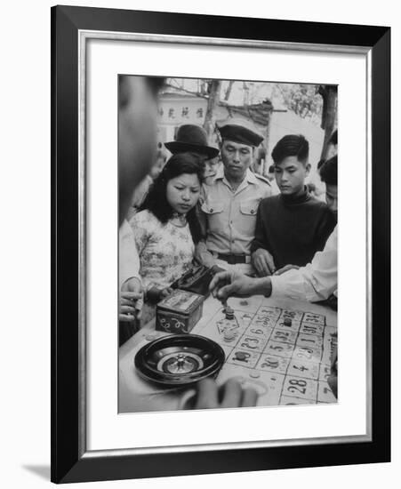 Game of Roulette at Fair in Central Highlands Celebrating New Year's Holiday-John Dominis-Framed Photographic Print