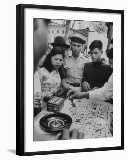 Game of Roulette at Fair in Central Highlands Celebrating New Year's Holiday-John Dominis-Framed Photographic Print
