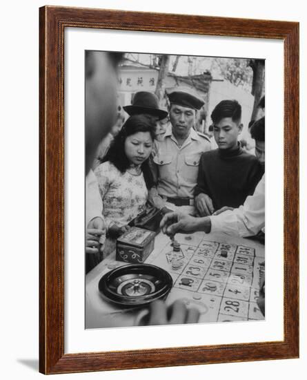 Game of Roulette at Fair in Central Highlands Celebrating New Year's Holiday-John Dominis-Framed Photographic Print