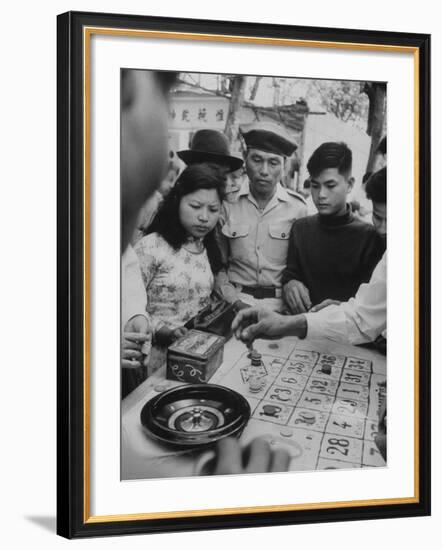 Game of Roulette at Fair in Central Highlands Celebrating New Year's Holiday-John Dominis-Framed Photographic Print