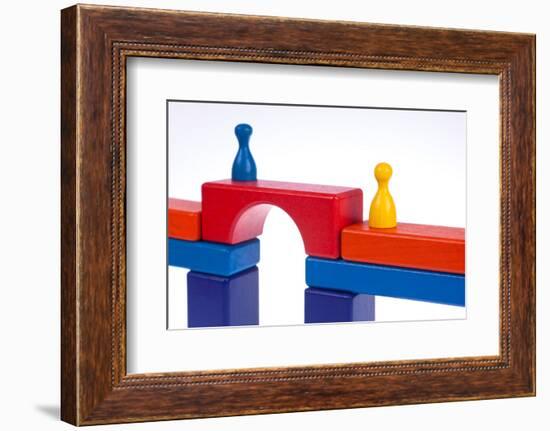 Gaming Pieces and Building Blocks Symbolising Breaking Down Barriers-Catharina Lux-Framed Photographic Print