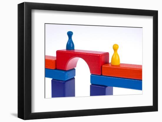 Gaming Pieces and Building Blocks Symbolising Breaking Down Barriers-Catharina Lux-Framed Photographic Print