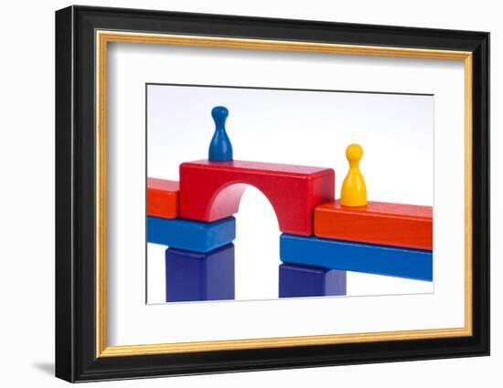 Gaming Pieces and Building Blocks Symbolising Breaking Down Barriers-Catharina Lux-Framed Photographic Print