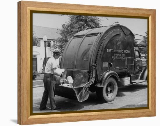 Garbage Man Emptying Trash into Back of Garbage Truck-Alfred Eisenstaedt-Framed Premier Image Canvas