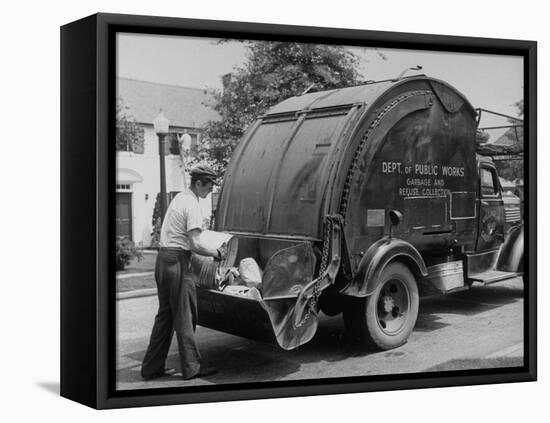 Garbage Man Emptying Trash into Back of Garbage Truck-Alfred Eisenstaedt-Framed Premier Image Canvas