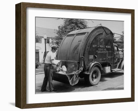 Garbage Man Emptying Trash into Back of Garbage Truck-Alfred Eisenstaedt-Framed Premium Photographic Print