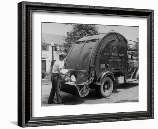 Garbage Man Emptying Trash into Back of Garbage Truck-Alfred Eisenstaedt-Framed Premium Photographic Print