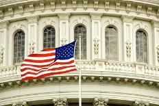 The Flag of the USA Flying in Front of the Capitol Building in Washington, Dc.-Gary Blakeley-Photographic Print