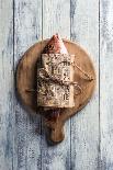 Red Snapper Wrapped in Chinese Newspaper on Wooden Background-Gary Jones-Photographic Print