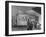 Gas Station Attendant Changing Oil for a Customer Next to Fill Up at the Refinery Sign-Margaret Bourke-White-Framed Photographic Print