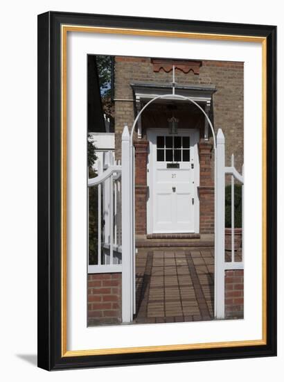 Gates Leading to Block Paving, and a White Front Door, of a Residential House-Natalie Tepper-Framed Photo