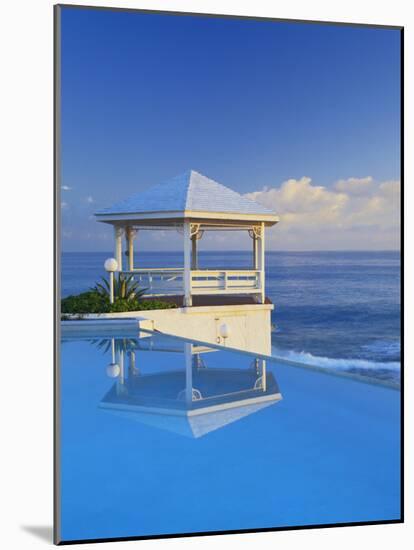 Gazebo Reflecting on Pool with Sea in Background, Long Island, Bahamas-Kent Foster-Mounted Photographic Print