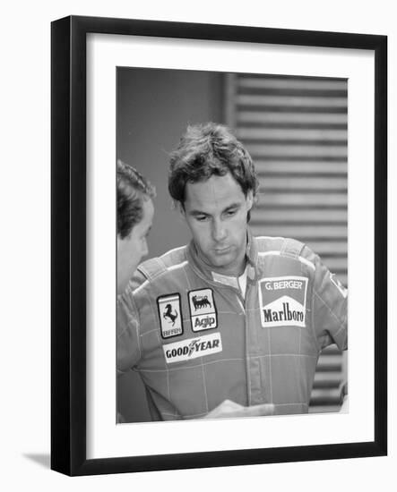 Gehard Berger Listening to a Member of the Ferrari Team, 1988-null-Framed Photographic Print