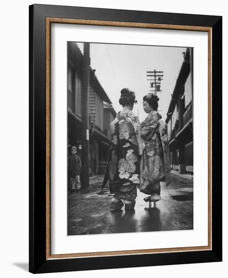 Geisha Girl Chats with Young Novice, Yoko Minami, Who is Studying to Become a Geisha-Alfred Eisenstaedt-Framed Photographic Print