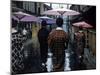 Geishas Carry Umbrellas of Oiled Japanese Paper Wearing Geta Walking in Rain, Gion Geisha Quarter-Eliot Elisofon-Mounted Photographic Print