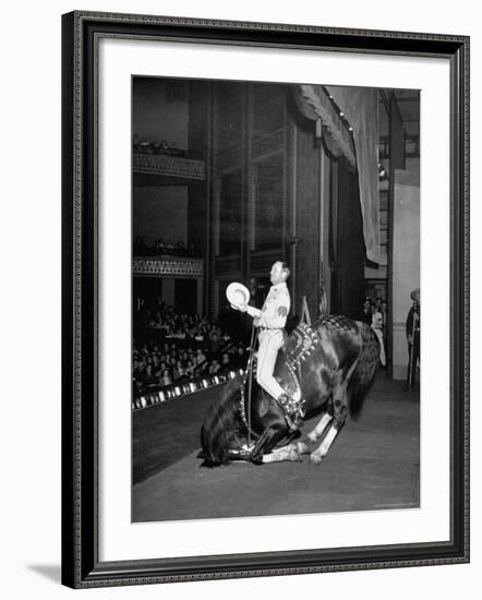 Gene Autry Astride His Famous Horse Champion on Bent Front Knees, Touching Head to Floor, on Stage-Thomas D^ Mcavoy-Framed Premium Photographic Print