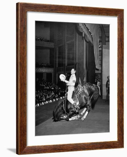 Gene Autry Astride His Famous Horse Champion on Bent Front Knees, Touching Head to Floor, on Stage-Thomas D^ Mcavoy-Framed Premium Photographic Print