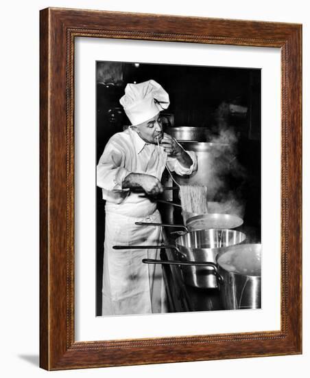 Gene Leone, Taking a Bite Test to Determine Whether the Bo Ling Spaghetti is Properly Firm-Eliot Elisofon-Framed Photographic Print