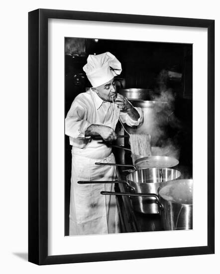 Gene Leone, Taking a Bite Test to Determine Whether the Bo Ling Spaghetti is Properly Firm-Eliot Elisofon-Framed Photographic Print