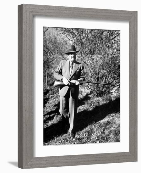 General Francisco Franco, Pointing His Gun Toward the Ducklings in the River-Dmitri Kessel-Framed Photographic Print