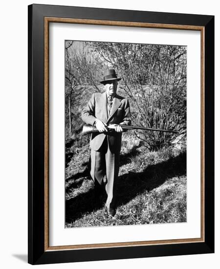 General Francisco Franco, Pointing His Gun Toward the Ducklings in the River-Dmitri Kessel-Framed Photographic Print