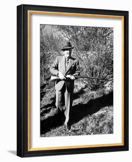 General Francisco Franco, Pointing His Gun Toward the Ducklings in the River-Dmitri Kessel-Framed Photographic Print