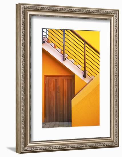 Geometric view of a yellow and orange stairway.-Tom Haseltine-Framed Photographic Print