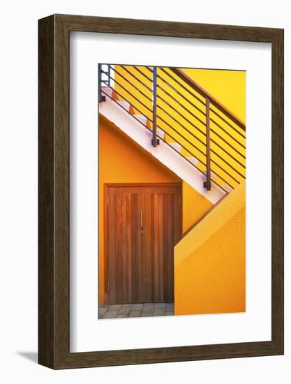 Geometric view of a yellow and orange stairway.-Tom Haseltine-Framed Photographic Print