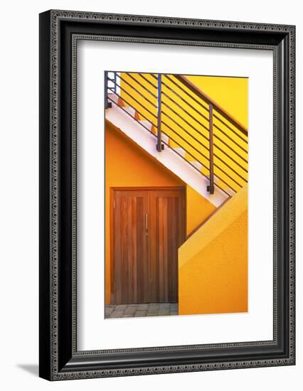 Geometric view of a yellow and orange stairway.-Tom Haseltine-Framed Photographic Print