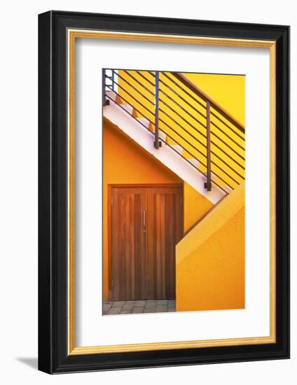 Geometric view of a yellow and orange stairway.-Tom Haseltine-Framed Photographic Print