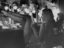 Chorus Girl-Singer Linda Lombard, Resting Her Legs after a Tough Night on Stage-George Silk-Photographic Print
