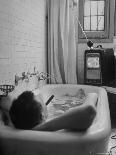 Writer Russell Finch Taking Portable Television Set to Bathroom During His Bath-George Skadding-Framed Photographic Print