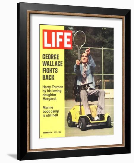 George Wallace in Wheelchair, About to Hit Tennis Ball, November 24, 1972-Bill Eppridge-Framed Photographic Print