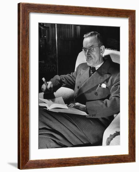 German-Born Writer Thomas Mann Reading a Book at Home-Carl Mydans-Framed Premium Photographic Print